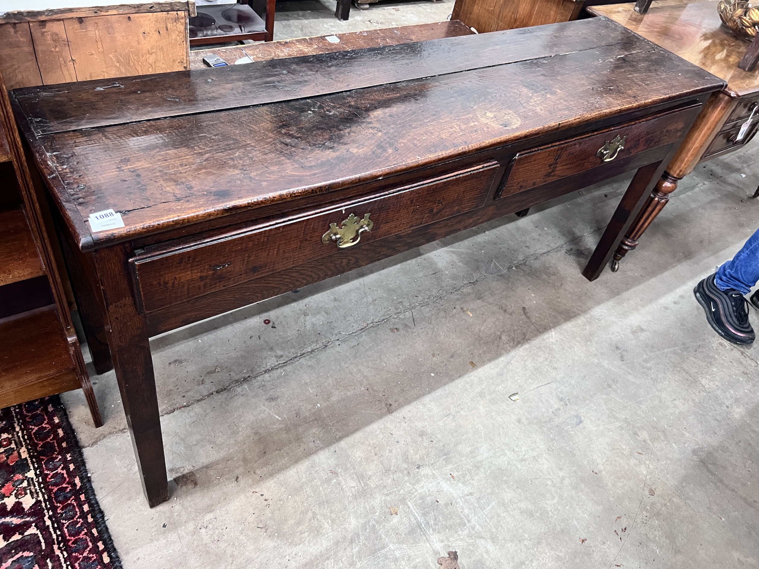 An 18th century oak low dresser, fitted two drawers, width 168cm, depth 45cm, height 78cm